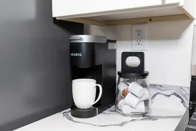 a coffee maker on a counter in a kitchen at Adjoining Condominium Units Sleeps 12 in Downtown Sandusky! in Sandusky