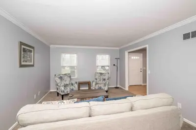 a living room with a couch and two chairs at Peaceful Dove in Tylersville