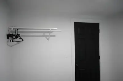 a room with a black door and a shelf next to a door at Buckeye Lake Getaway in Thornville