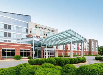 an office building with a sign on the front of it at Hyatt Place at The Hollywood Casino Pittsburgh South in Washington