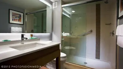a bathroom with a sink and a shower at Hyatt Place at The Hollywood Casino Pittsburgh South in Washington