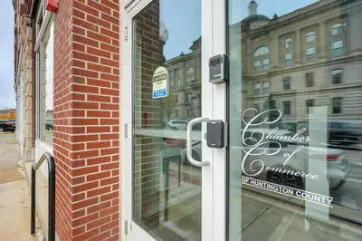 a glass door with a sign on the side of a building at Unique and Stylish Studio Loft in Huntington! in Huntington