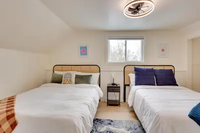 two beds sitting next to each other in a bedroom at 3 Mi to Dtwn and YSU Updated Youngstown Home in Youngstown