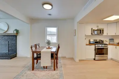 a kitchen and dining room with a table and chairs at 3 Mi to Dtwn and YSU Updated Youngstown Home in Youngstown