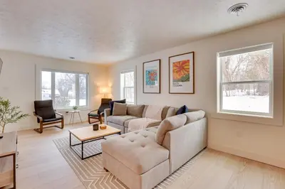 a living room with a couch and a table at 3 Mi to Dtwn and YSU Updated Youngstown Home in Youngstown