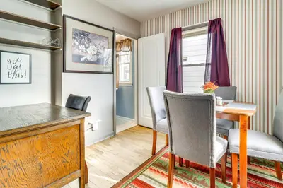 a dining room with a wooden table and chairs at Walk to Adrian College Family Home in Michigan in Adrian