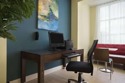 an office with a desk with a computer on it at Days Inn & Suites by Wyndham Belmont in Belmont