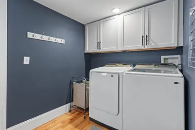 a kitchen with a white refrigerator and white cabinets at Italian Village Gem, Downtown, Free Parking, OSU in Columbus