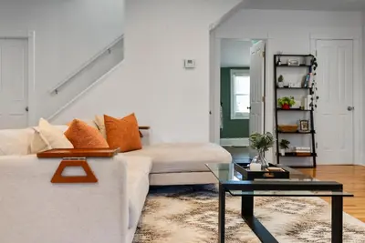 a living room with a couch and a table at Italian Village Gem, Downtown, Free Parking, OSU in Columbus