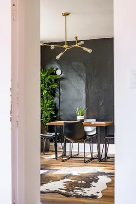 a dining room with a table and chairs at Jungle House Columbus Downtown Free Parking Sleeps 8 - Near Convention Center & Nationwide Arena - 2BR Luxury Home - Pet Friendly Over 5,800 Five Star Stays in Columbus