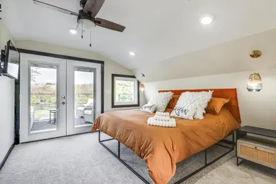 a bedroom with a large orange bed with white pillows at 5 Mi to WEC Pet-Friendly Home in Wilmington in Wilmington