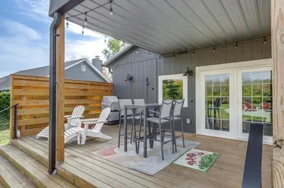a patio with a table and chairs on a deck at 5 Mi to WEC Pet-Friendly Home in Wilmington in Wilmington