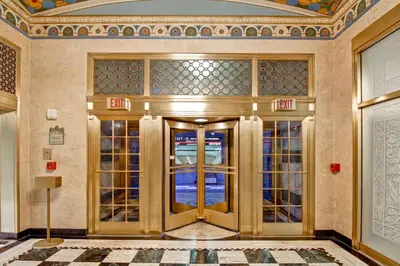 a lobby with a gold door in a building at Hampton Inn and Suites Cincinnati - Downtown in Cincinnati