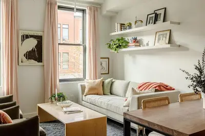 a living room with a couch and a table at Lux Condo Near Washington Park - Walk Everywhere in Cincinnati