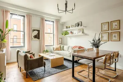a living room with a couch and a table at Lux Condo Near Washington Park - Walk Everywhere in Cincinnati