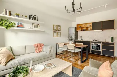 a living room with a couch and a table at Lux Condo Near Washington Park - Walk Everywhere in Cincinnati