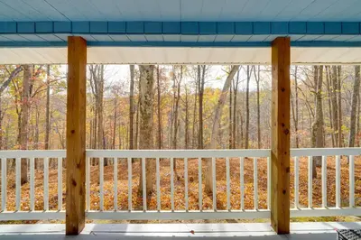a screened porch with a view of the woods at Shared Pond and Trails Rosedale Cottage! in Rosedale