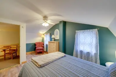 a bedroom with a bed and a table and a chair at Shared Pond and Trails Rosedale Cottage! in Rosedale