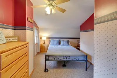 a bedroom with a bed and a ceiling fan at Shared Pond at Retreat in Rosedale! in Rosedale