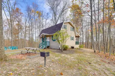 a small house with a picnic table in front of it at Shared Pond at Retreat in Rosedale! in Rosedale