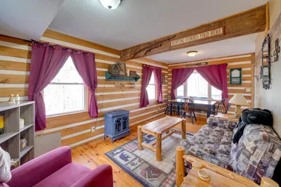a living room with a couch and a stove at Picnics and Bonfires Rosedale Retreat! in Rosedale