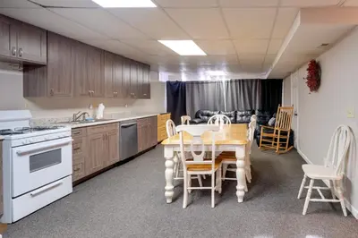 a kitchen with a table and chairs and a couch at Hike and Picnic at Group Getaway in Rosedale! in Rosedale