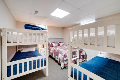 a bedroom with two bunk beds and a bed at Hike and Picnic at Group Getaway in Rosedale! in Rosedale