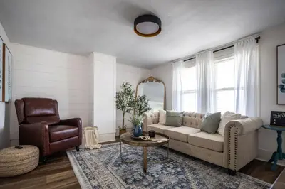 a living room with a couch and a chair at Walkable to Everywhere in Little Italy- Near CWRU and Cleveland Clinic Main Campus in Cleveland