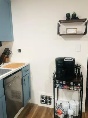 a kitchen with a stove and a counter top at Walkable to Everywhere in Little Italy- Near CWRU and Cleveland Clinic Main Campus in Cleveland