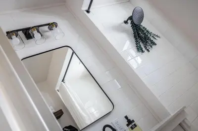 an overhead view of a bathroom with a mirror at Walkable to Everywhere in Little Italy- Near CWRU and Cleveland Clinic Main Campus in Cleveland