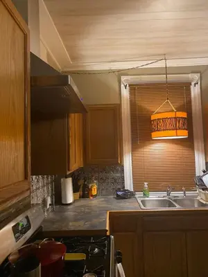 a kitchen with a sink and a window at Charming Wheeling Island Home in Wheeling