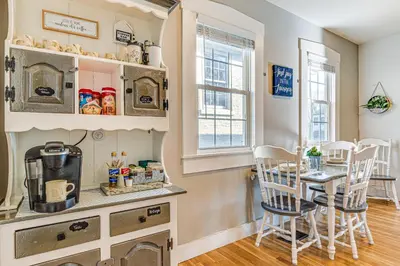 a kitchen and dining room with a table and chairs at East End River Retreat Dogs Welcome! in Madison