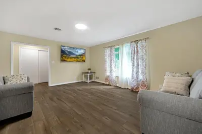 a living room with two couches and a window at Tranquil Stay in Columbus in Gahanna