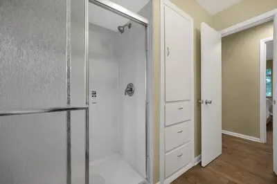 a shower with a glass door in a bathroom at Tranquil Stay in Columbus in Gahanna