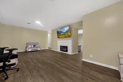 a living room with a fireplace and a tv at Tranquil Stay in Columbus in Gahanna