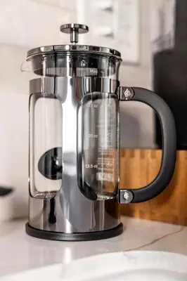 a coffee maker sitting on a kitchen counter at Mid-Century Modern Retreat in Little Italy in Cleveland