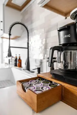 a coffee maker sitting on top of a kitchen counter at Mid-Century Modern Retreat in Little Italy in Cleveland