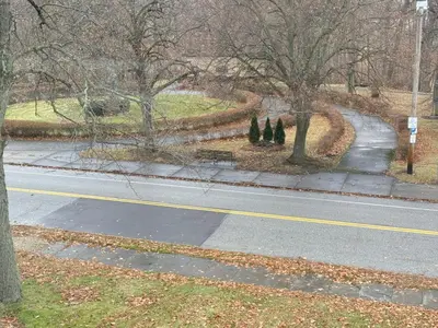 an empty street with trees on the side of the road at Beautiful Home Near Downtown & Cultural Gardens! in Cleveland