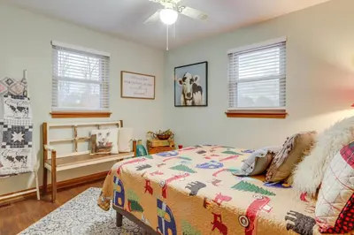a bedroom with a bed and windows at 34 Mi to Ark Encounter Kentucky Family Farmhouse in New Richmond