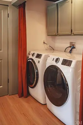 a washer and dryer in a laundry room at Sunset Cottage Hocking Hills in Rockbridge