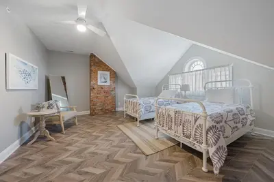 a bedroom with two beds in a attic at Presidential Suite Sandusky Waterfront Area in Sandusky