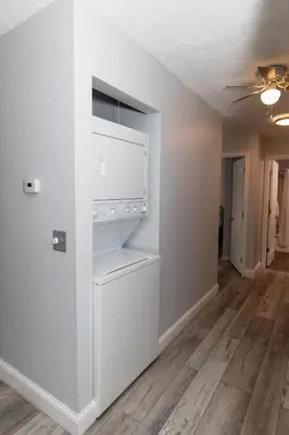 an empty living room with a white closet at Modern Condo Central Huron Boat Basin Area in Huron