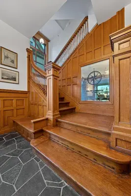 a staircase in a home with wood paneling at Luxury Boutique Downtown Private Unit in Sandusky