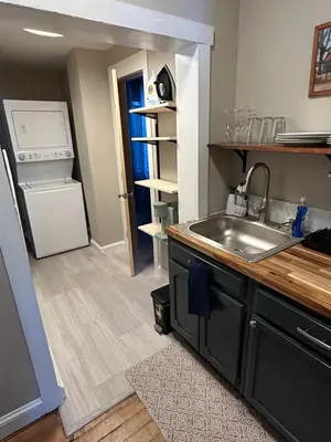 a kitchen with a sink and a refrigerator at Davenport House in Springfield in Springfield