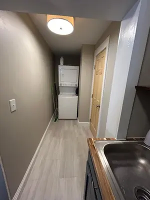 a small kitchen with a sink and a refrigerator at Davenport House in Springfield in Springfield