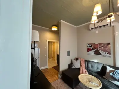 a living room with a couch and a table at Davenport House in Springfield in Springfield