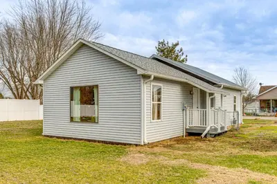 a small white house in a yard at 17 Mi to Brookville Lake Home with In-Unit Laundry in Connersville