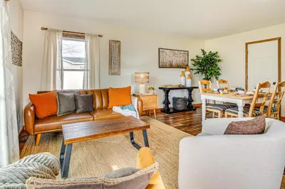 a living room with a couch and a table at 17 Mi to Brookville Lake Home with In-Unit Laundry in Connersville