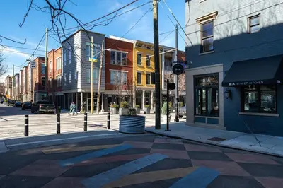 a city street with buildings and a crosswalk at Modern Condo in the heart of Over-The-Rhine in Cincinnati