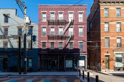 a building with a fire escape on the side of it at Modern Condo in the heart of Over-The-Rhine in Cincinnati